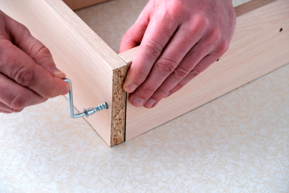 Assembling,Furniture,Box,,Mens,Hands,Tighten,Screw,With,Key,,Close-up.